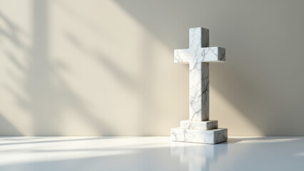 A white marble crucifix on a reflective surface with soft lighting.
