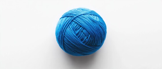 Fototapeta premium A ball of blue yarn on a white background.
