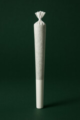 Minimal Cannabis Joint on Dark Green Background