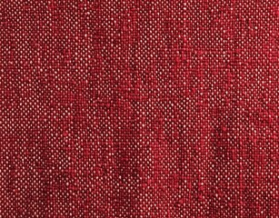 A flat lay of rich red cotton fabric showcasing a smooth texture under soft studio lighting, highlighting high-resolution details and vibrant color in a clean, sharp focus.