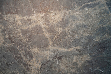 Black marble surface with gold and white natural veins