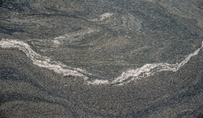 Silver Wave granite with textured surface and white veins