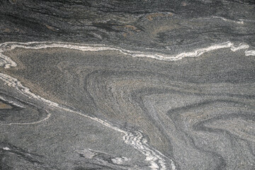 Texture of Asian granite with silver base and white veins