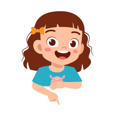 Happy Little Girl Smiling and Pointing Down, Demonstrating or Presenting Something with Cheerful Expression