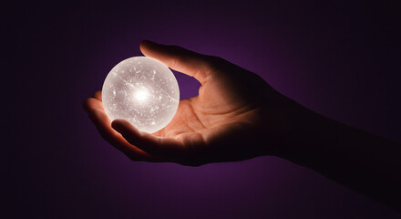 hand holding a light bulb