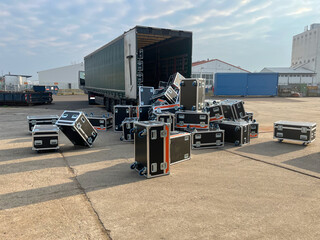 Loading or Unloading incident: road cases fell off a truck trailer at an industrial site