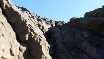 rock formation with a blue sky in the background