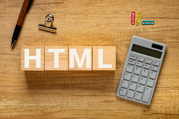 There is wood cube with the word HTML. It is an abbreviation for Hyper Text Markup Language as...