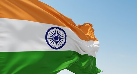 Indian tricolor flag waving gracefully against bright blue sky background