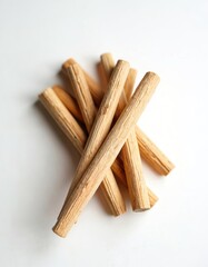 Palo santo aroma sticks on white background. Natural incense from Bursera graveolens tree. Used for spiritual practice, aromatherapy, cleansing negative energy.