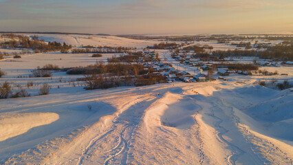 snow-covered winter fields in the cold in the sun