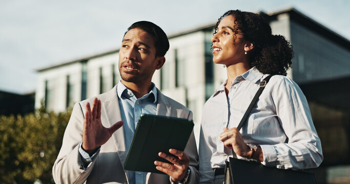 Business, people and talk with tablet in city for planning, engineer team and urban development. Man, woman or discussion with digital for information, project management and infrastructure expansion
