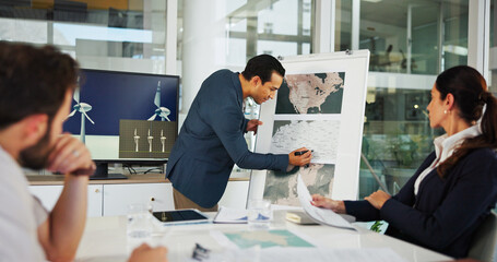 Businessman, writing or meeting with whiteboard for project planning on renewable energy at office. Man, employee or team with geographic data, map or wind turbine distribution for global development