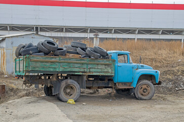 Old car tires in the back of a truck