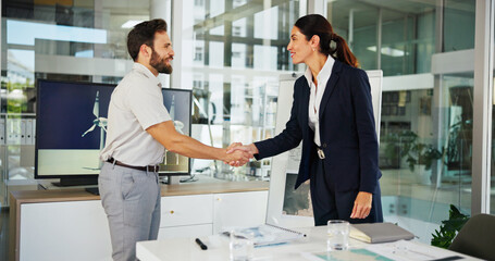 Ecology, meeting and business people with handshake for renewable, climate change or clean energy. Environmental consultnat, investor or shaking hands with ecologist wind turbine for eco development