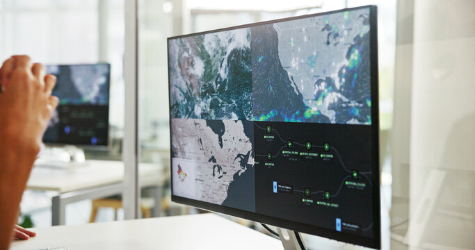 Hands, computer and screen with weather report for climate change, map and global forecast in office. Person, monitor and meteorology research at work with storm analysis, tornado warning and wind