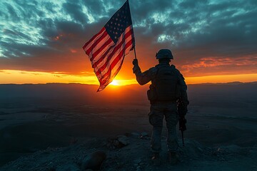 Obraz premium Armed Soldier Holding American Flag on Hilltop During Sunset, Silhouetted Figure