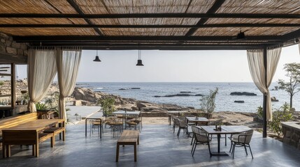 Obraz premium Open-air seating area facing sea with breezy curtains and minimalist decor