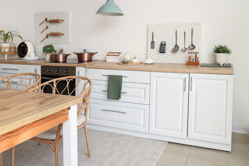 Interior of kitchen with white counter and peg board