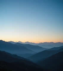 Fototapeta premium The majestic mountains rise dramatically, their peaks shrouded in a soft, ethereal mist that gently envelops the rugged terrain, creating a serene and mysterious atmosphere.