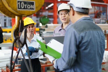 Industrial engineer team works together in factory.