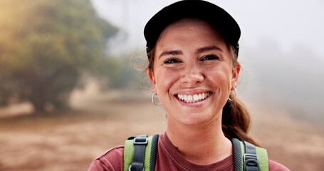Smile, hiking and portrait of woman in nature for adventure, exploring or discovery on holiday. Excited, confident and female person from Australia on trekking and backpacking trip outdoor in forest. © peopleimages.com