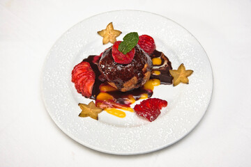 Fried ice cream, fried ice cream dessert with strawberries and covered in chocolate on a white background