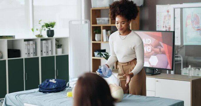 First aid, mannequin and woman with presentation, teaching and workshop for skills development. Group, medical and presenter with advice, healthcare and course for emergency, doll for cpr or learning
