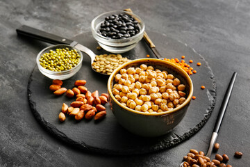 Composition with different legumes on dark background