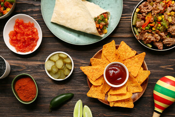 Traditional Mexican food on black wooden background. Cinco de Mayo (Fifth of May) celebration