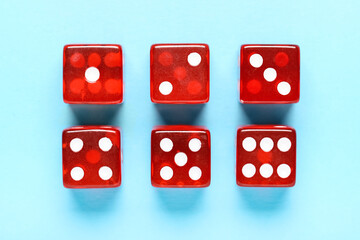Red game dices on blue background