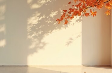 Minimalist cream color autumn scene. Shadows of maple tree leaves fall on a wall, tree branches with orange leaves in the corner. Light, shadow, fall season background.