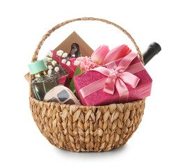 Gift basket with spring flowers, wine and cosmetics on white background