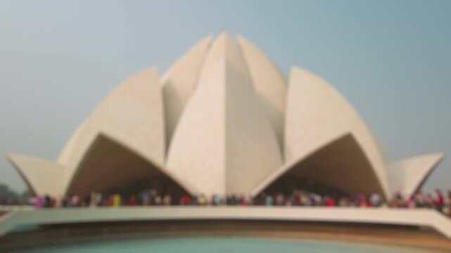 Bokeh view of tourists visited Lotus Temple in New Delhi, India. Blurred background footage.