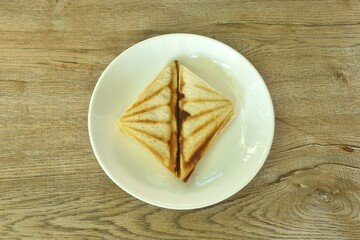 baking sandwich stuffing ham and cheese arraning on plate