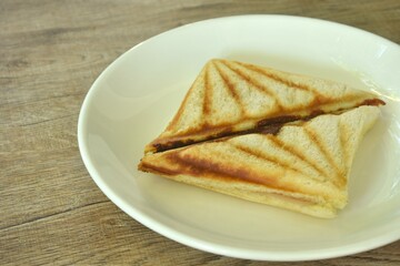 baking sandwich stuffing ham and cheese arraning on plate