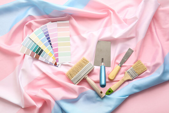 Color palettes with construction tools and transgender flag on pink background