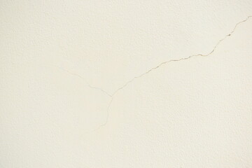 crack on white wall from earthquake, construction industry