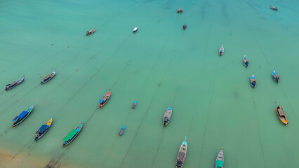 Aerial view of Ko Surin Marine National Park. Traditional long-tail boats and houses of Moken tribe Village or Sea Gypsies and tropical waters of Surin Islands in Thailand, Phang Nga. © tonjung