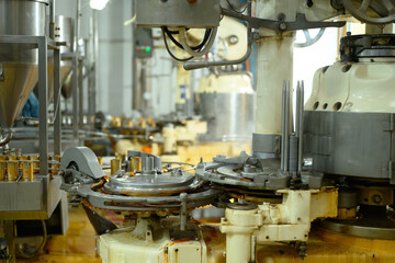 Close up view of industrial machinery operating in a canned fish factory