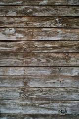 Fototapeta premium Old wooden door made of shabby planks