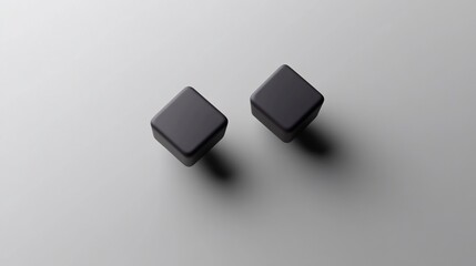 Two dark gray cubes on light gray background