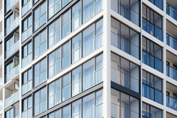 Fototapeta premium Modern Glass Apartment Building Facade with Reflections and Minimalist Architecture