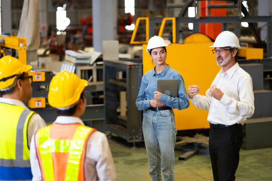 Morning Brief meeting. Professional supervisor engineers assignmenting discussion together before start working In morning meeting. metal sheet profiling factory. Industrial production