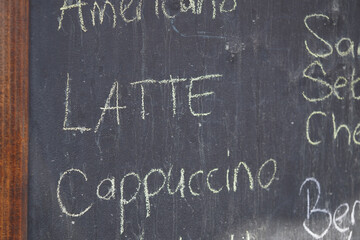 Coffee menu board featuring various drink options in chalk