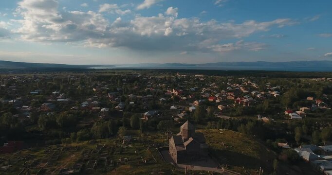 Aerial view of Kotavank church in Nerkin Getashen village, Gegharkunik Province of Armenia at sunset