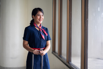 Portrait female Cabin crew or air hostess in airport. Cabin crew, air hostess working in airplane....