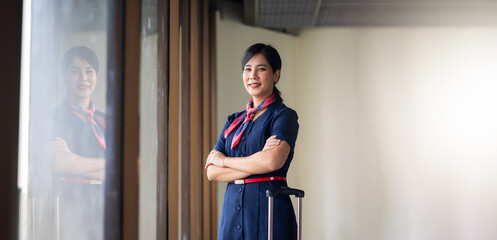 Portrait female Cabin crew or air hostess in airport. Cabin crew, air hostess working in airplane....