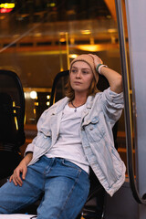 Woman is sitting on a subway train