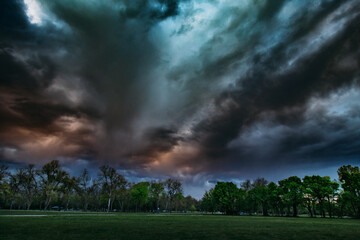 Dark storm clouds with orange glow overhead